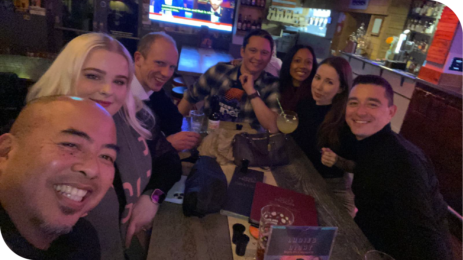 A photograph of some of the GV team and Kim and Cailee from Andar in a restaurant, smiling at the camera.